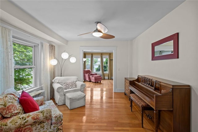 77 Friendly Rd, Cranston, RI 02910 - living area with healthy amount of natural light, light wood-style floors, and ceiling fan
