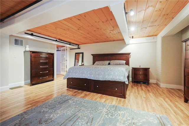 1 Tupperware Dr Unit 121, North Smithfield, RI 02896 - bedroom featuring wooden ceiling, baseboards, wood finished floors, and a barn door