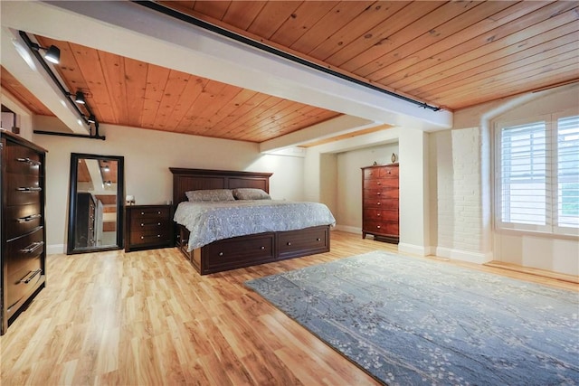 1 Tupperware Dr Unit 121, North Smithfield, RI 02896 - bedroom featuring light wood-style floors, baseboards, and wooden ceiling with exposed beams