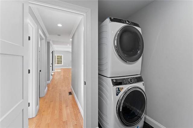 117 Mann School Rd, Smithfield, RI 02917 - washroom with stacked washer and clothes dryer, light wood-type flooring, crown molding, baseboards, and recessed lighting