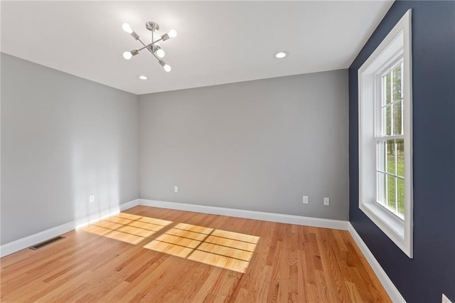 117 Mann School Rd, Smithfield, RI 02917 - empty room featuring light wood finished floors, a chandelier, baseboards, and recessed lighting