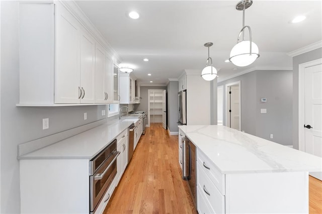 117 Mann School Rd, Smithfield, RI 02917 - kitchen with a kitchen island, stainless steel appliances, ornamental molding, white cabinetry, and recessed lighting