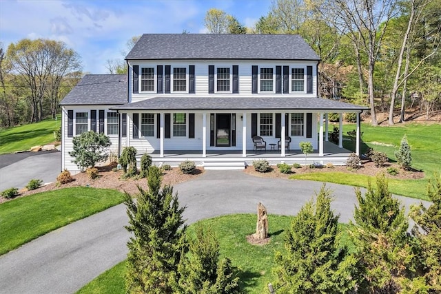 117 Mann School Rd, Smithfield, RI 02917 - view of front of home featuring asphalt driveway, a front yard, a porch, and roof with shingles