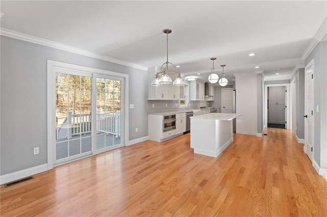 117 Mann School Rd, Smithfield, RI 02917 - kitchen featuring appliances with stainless steel finishes, light countertops, white cabinetry, a kitchen island, and recessed lighting