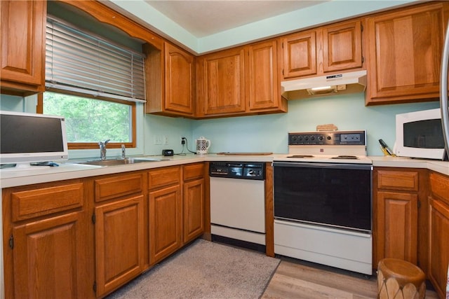 10 Leach St Unit B4, Cumberland, RI 02864 - kitchen featuring white appliances, under cabinet range hood, light countertops, and a sink