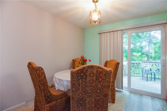 10 Leach St Unit B4, Cumberland, RI 02864 - dining area with a chandelier and wood finished floors