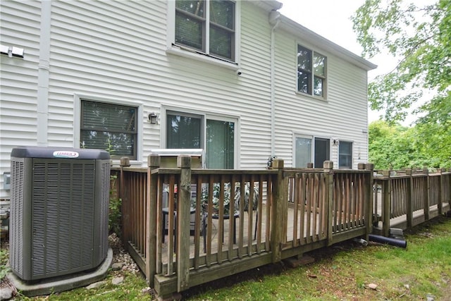 10 Leach St Unit B4, Cumberland, RI 02864 - rear view of property featuring central AC unit and a wooden deck