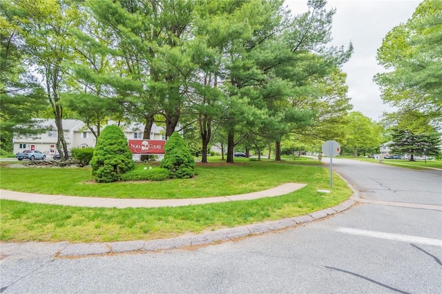 26 Noel Ct, South Kingstown, RI 02879 - view of front of house featuring a front lawn