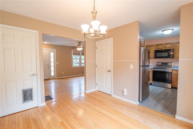 26 Noel Ct, South Kingstown, RI 02879 - unfurnished dining area featuring light wood-type flooring, a chandelier, ceiling fan, and baseboards