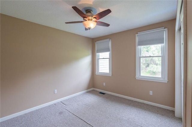 26 Noel Ct, South Kingstown, RI 02879 - carpeted spare room with plenty of natural light, baseboards, and ceiling fan