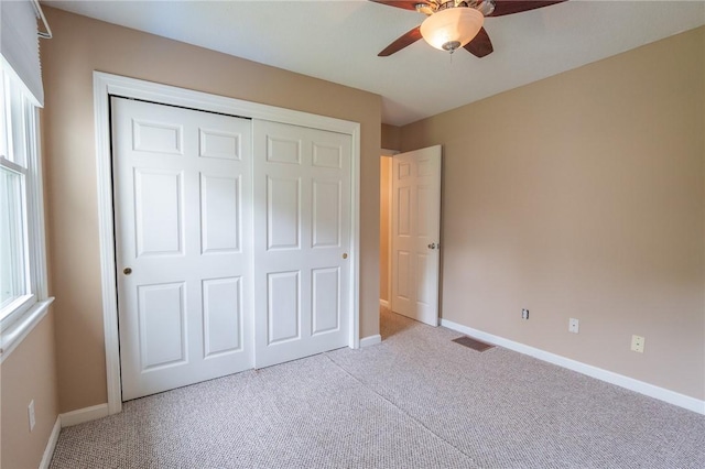 26 Noel Ct, South Kingstown, RI 02879 - unfurnished bedroom with carpet, a closet, baseboards, and a ceiling fan