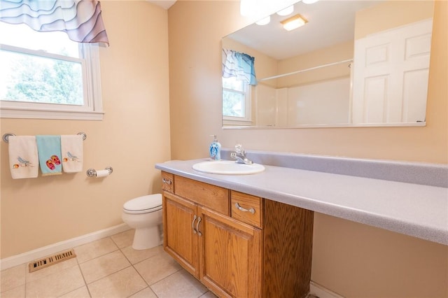 26 Noel Ct, South Kingstown, RI 02879 - bathroom with toilet, vanity, plenty of natural light, and tile patterned flooring