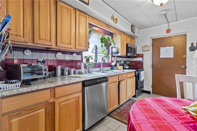 510 Child St Unit 105B, Warren, RI 02885 - kitchen featuring stainless steel appliances, a sink, light tile patterned floors, backsplash, and light stone countertops