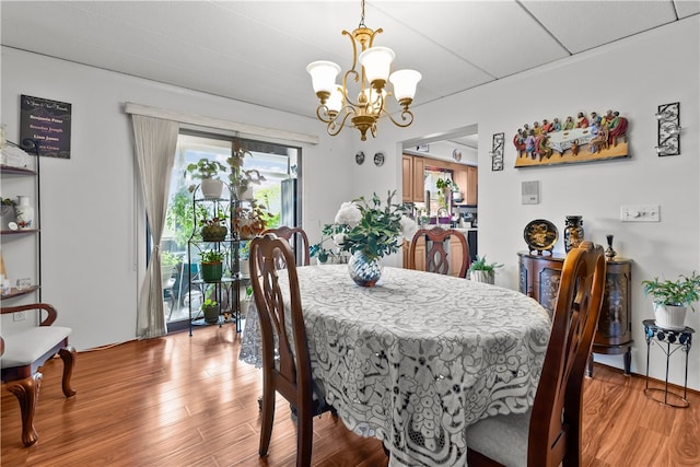 510 Child St Unit 105B, Warren, RI 02885 - dining space featuring a chandelier, light wood finished floors, and plenty of natural light