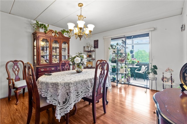 510 Child St Unit 105B, Warren, RI 02885 - dining room featuring a chandelier and light wood-type flooring