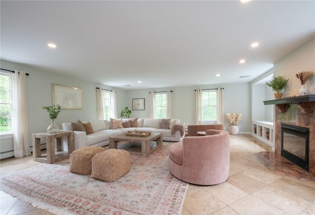 200 Miner Rd, North Kingstown, RI 02874 - living area with recessed lighting, light tile patterned floors, and a tile fireplace