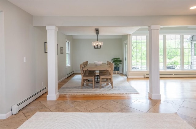 200 Miner Rd, North Kingstown, RI 02874 - dining space with a baseboard heating unit, decorative columns, light tile patterned flooring, and a chandelier
