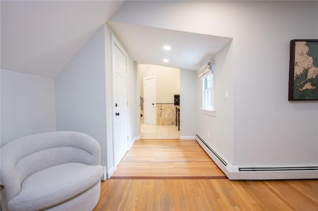 200 Miner Rd, North Kingstown, RI 02874 - hallway with a baseboard radiator, light wood-style floors, baseboards, lofted ceiling, and recessed lighting