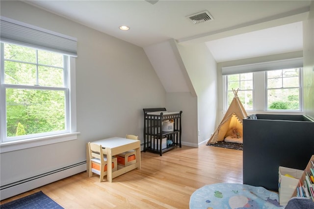 200 Miner Rd, North Kingstown, RI 02874 - rec room with a baseboard heating unit, healthy amount of natural light, light wood-style flooring, vaulted ceiling, and recessed lighting