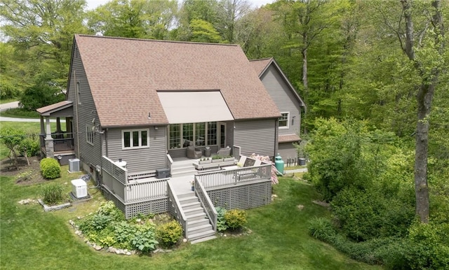200 Miner Rd, North Kingstown, RI 02874 - rear view of house featuring stairway, a wooden deck, a lawn, and central AC unit