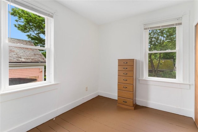 53 Warner St, Newport, RI 02840 - spare room with healthy amount of natural light, light wood-style flooring, and baseboards