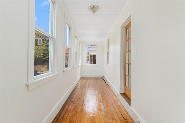 53 Warner St, Newport, RI 02840 - hall featuring baseboard heating, hardwood / wood-style floors, and baseboards