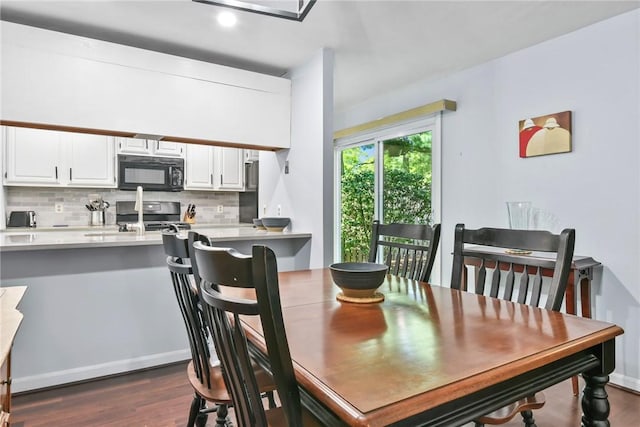 18 Caddy Rock Rd Unit C, North Kingstown, RI 02852 - dining room with dark wood-style floors and baseboards