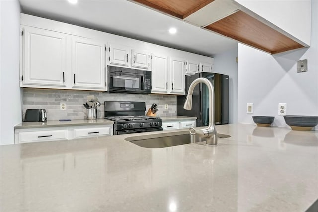 18 Caddy Rock Rd Unit C, North Kingstown, RI 02852 - kitchen featuring black appliances, a sink, decorative backsplash, white cabinetry, and recessed lighting