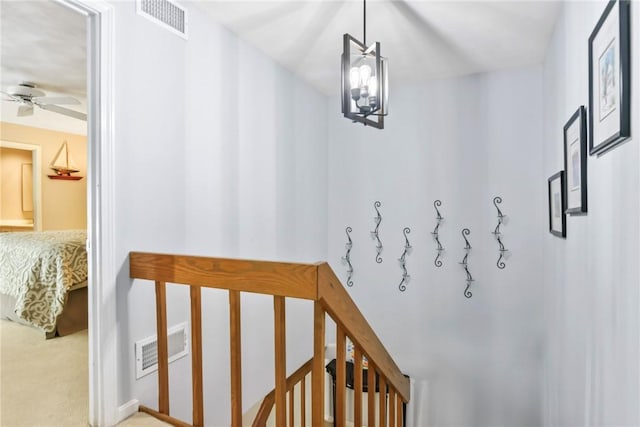 18 Caddy Rock Rd Unit C, North Kingstown, RI 02852 - stairs with ceiling fan, a chandelier, and carpet flooring