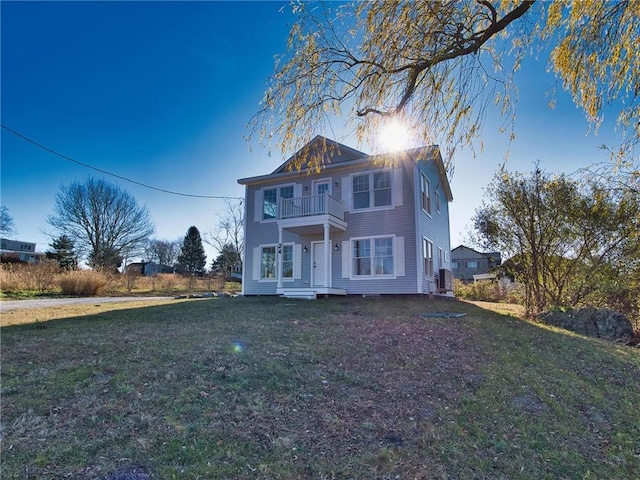 24 Seaspray Way, Little Compton, RI 02837 - view of front of home with a balcony and a front lawn