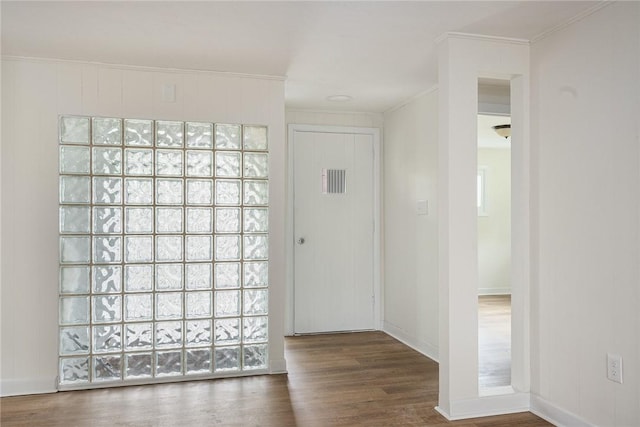 613 Prospect St, Woonsocket, RI 02895 - entrance foyer with ornamental molding, wood finished floors, and baseboards