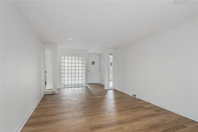 613 Prospect St, Woonsocket, RI 02895 - unfurnished living room featuring wood finished floors and baseboards