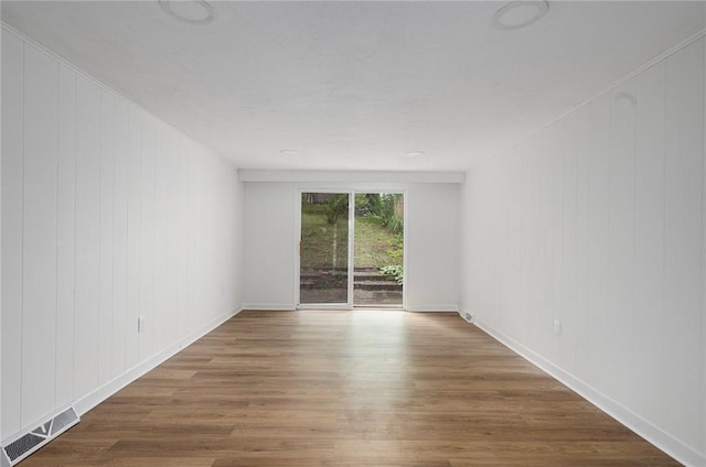 613 Prospect St, Woonsocket, RI 02895 - empty room featuring wood finished floors and baseboards