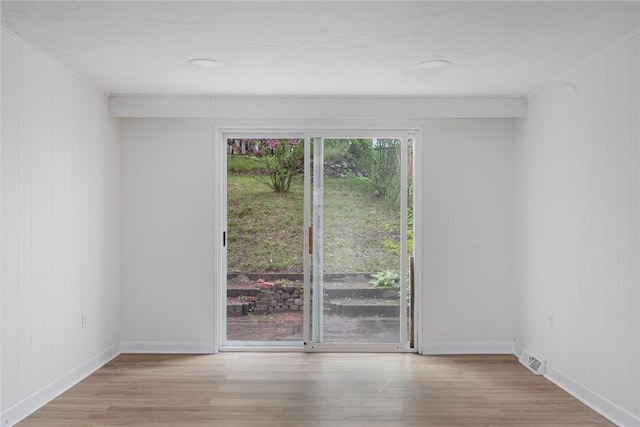 613 Prospect St, Woonsocket, RI 02895 - unfurnished room with wood finished floors, crown molding, baseboards, and wooden walls