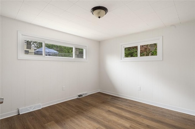 613 Prospect St, Woonsocket, RI 02895 - empty room with dark wood-type flooring and baseboards