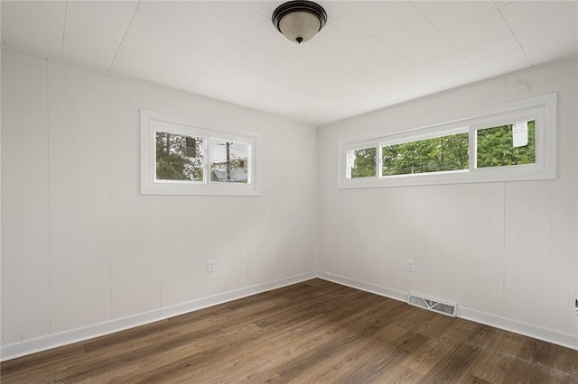 613 Prospect St, Woonsocket, RI 02895 - empty room with dark wood-style flooring and baseboards