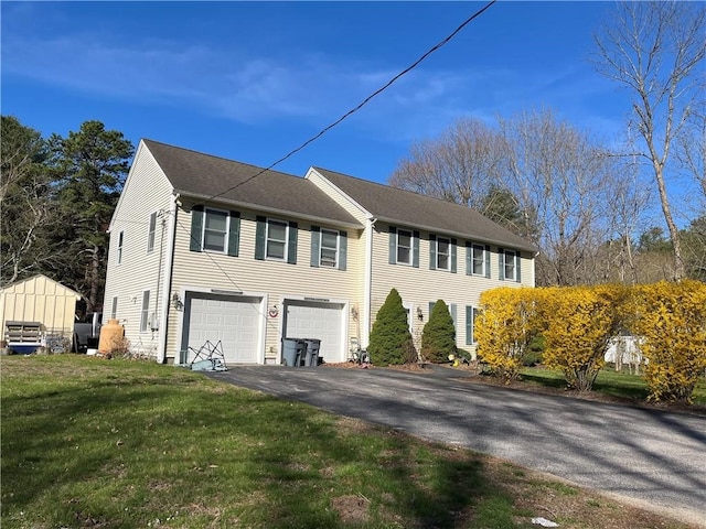 372 Mishnock Rd, West Greenwich, RI 02817 - view of front facade with asphalt driveway, a garage, and a front yard