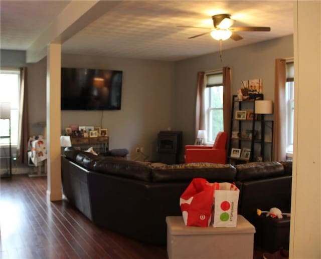 372 Mishnock Rd, West Greenwich, RI 02817 - living area with a wood stove, a ceiling fan, and dark wood finished floors