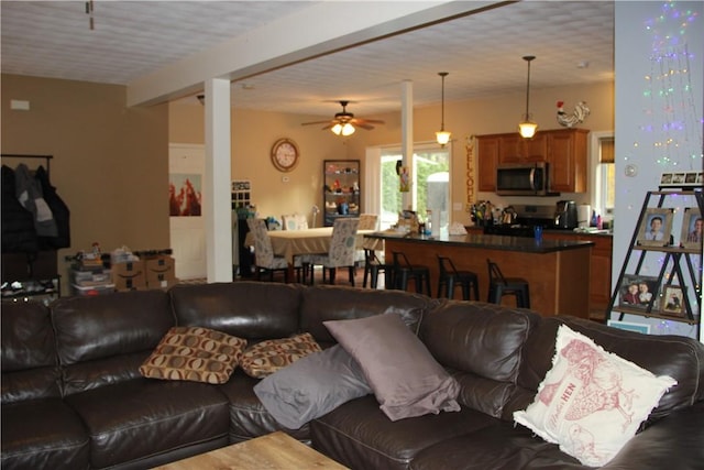 372 Mishnock Rd, West Greenwich, RI 02817 - living area featuring a ceiling fan and beamed ceiling