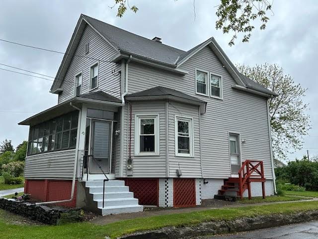 30 Pomham St, Cranston, RI 02910 - back of property featuring entry steps, a chimney, and a sunroom