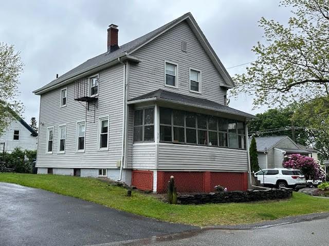 30 Pomham St, Cranston, RI 02910 - view of side of property featuring a chimney and a sunroom