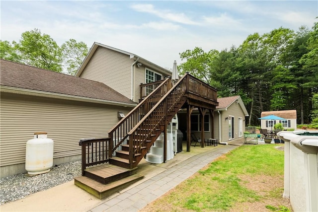 187 Plainfield Pike, Scituate, RI 02857 - rear view of house with a wooden deck, a patio, stairway, an outdoor structure, and a yard