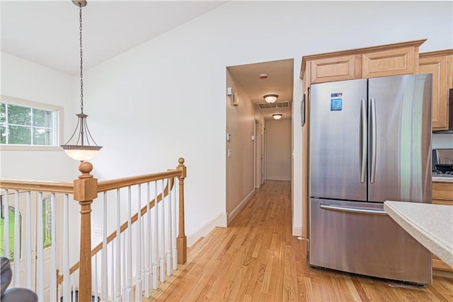 187 Plainfield Pike, Scituate, RI 02857 - kitchen with freestanding refrigerator, light wood-style floors, light countertops, and baseboards