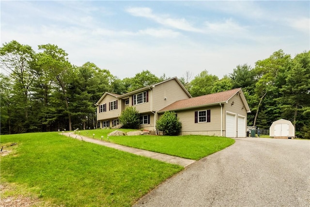 187 Plainfield Pike, Scituate, RI 02857 - view of front of property with a front lawn, asphalt driveway, and a garage