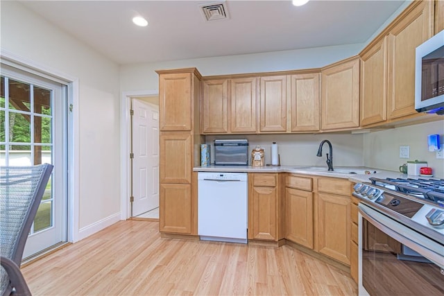 187 Plainfield Pike, Scituate, RI 02857 - kitchen with appliances with stainless steel finishes, light wood-style flooring, light countertops, recessed lighting, and light brown cabinets