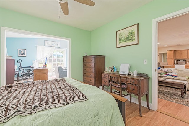 187 Plainfield Pike, Scituate, RI 02857 - bedroom with light wood finished floors, a desk, and a ceiling fan
