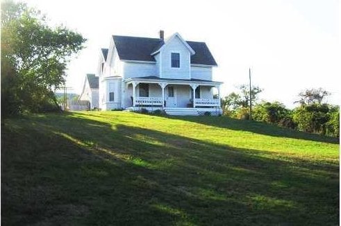 540 Off Center Rd, Block Island, RI 02807 - view of front of property featuring covered porch, a front lawn, and a chimney