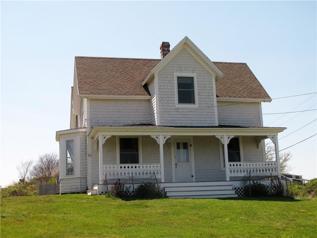 540 Off Center Rd, Block Island, RI 02807 - view of front of property with a chimney, covered porch, roof with shingles, and a front lawn