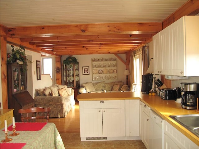 540 Off Center Rd, Block Island, RI 02807 - kitchen with open floor plan, white dishwasher, a peninsula, white cabinetry, and beamed ceiling