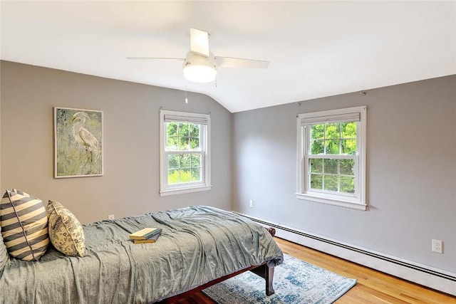 15 Lafayette Rd, Barrington, RI 02806 - bedroom with a baseboard radiator, wood finished floors, vaulted ceiling, and a ceiling fan